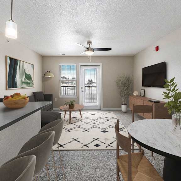 Thumbnail 3 of 14 A modern kitchen with a dining table and chairs at Eagle Ridge Apartment Homes, Traverse City, MI 49685