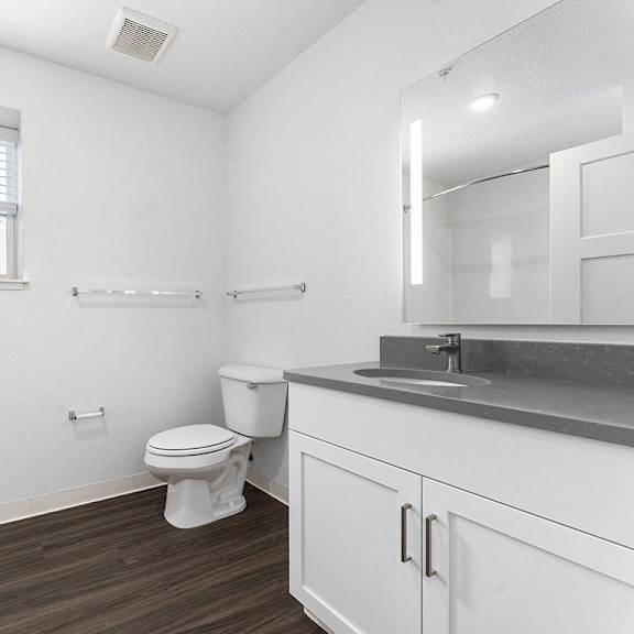 Thumbnail 12 of 15 A bathroom with a window at Eagle Ridge Apartment Homes, Traverse City, 49685