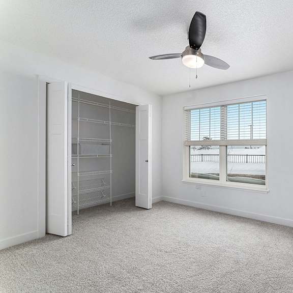 Thumbnail 15 of 15 Bedroom with large closet and window at Eagle Ridge Apartment Homes, Traverse City