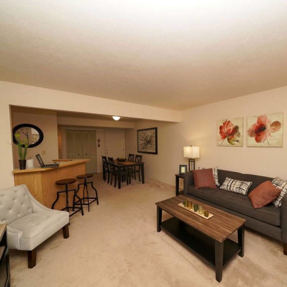 Thumbnail 4 of 10 A spacious living and dining room at Emerald Park Apartments, Kalamazoo