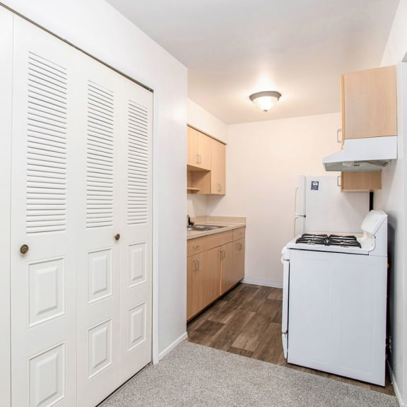 Thumbnail 10 of 17 a kitchen with a large closet at Fairlane Apartments in Springfield, MI 49037
