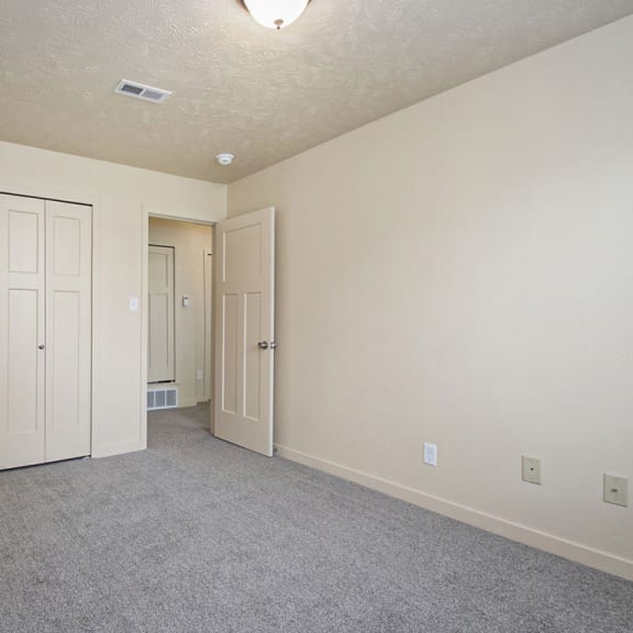 Thumbnail 13 of 13 A bedroom with a large closet and carpeting at Old Farm Apartments, Elkhart, 46517