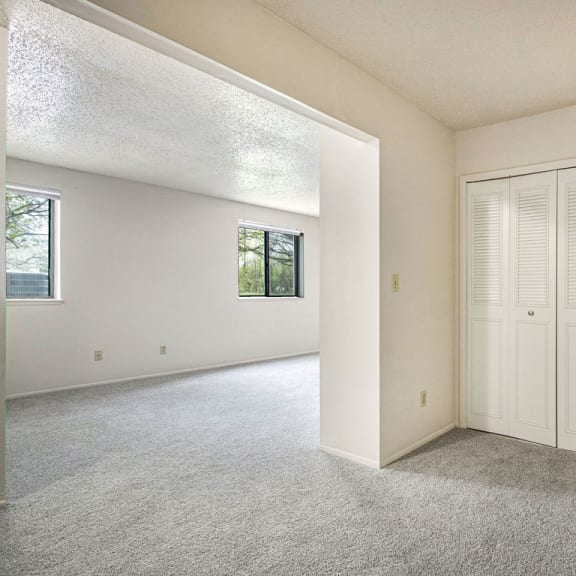 Thumbnail 12 of 12 sleeping room with white closet doors and carpet at Old Farm Apartments, Elkhart, 46517