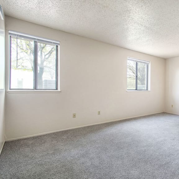 Thumbnail 6 of 12 large living room with carpet and two windows at Old Farm Apartments, Elkhart, 46517
