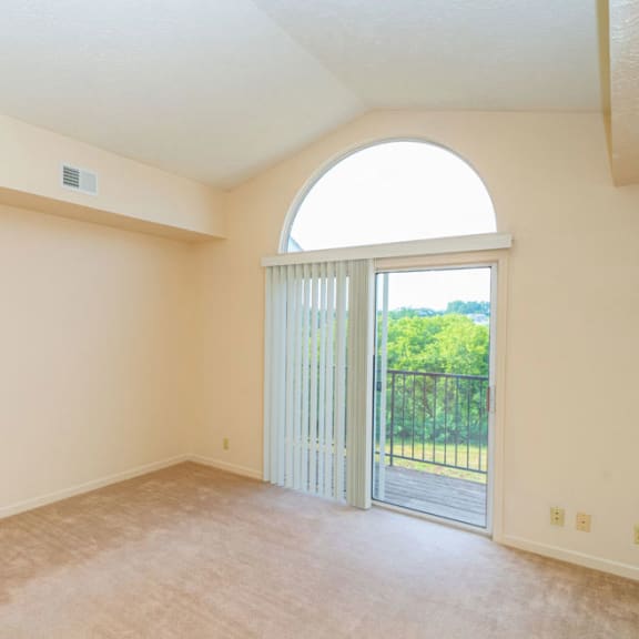 Thumbnail 3 of 9 living room with cathedral ceiling at Fieldstream Apartment Homes, Ankeny, IA