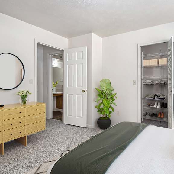 Thumbnail 7 of 7 A bedroom with a bed, dresser, and a walk-in closet at Fieldstream Apartment Homes, Iowa