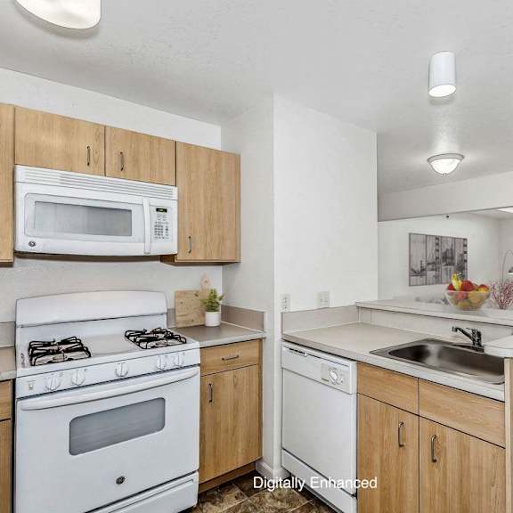 Thumbnail 6 of 12 a kitchen with a stove microwave and dishwasher at Fieldstream Apartment Homes in Ankeny, IA