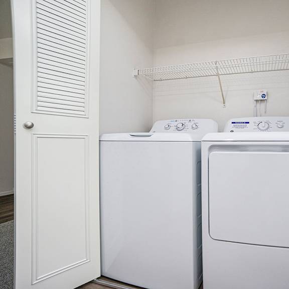 Thumbnail 9 of 12 A white washing machine and dryer at Foxwood and The Hermitage in Portage, MI