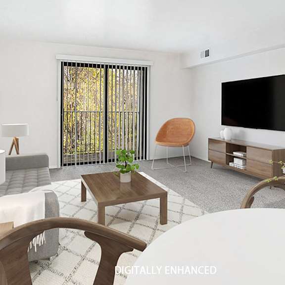 Thumbnail 3 of 8 A modern living room with a grey sofa, a wooden coffee table, and a slider to a balcony at Foxwood and The Hermitage, Michigan