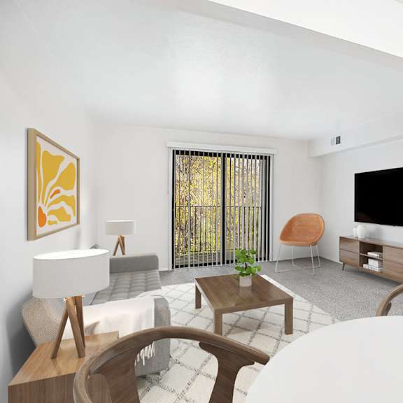 Thumbnail 3 of 11 A living room with a sofa, a wooden coffee table, a TV, and a plant at Foxwood and The Hermitage in Portage, MI