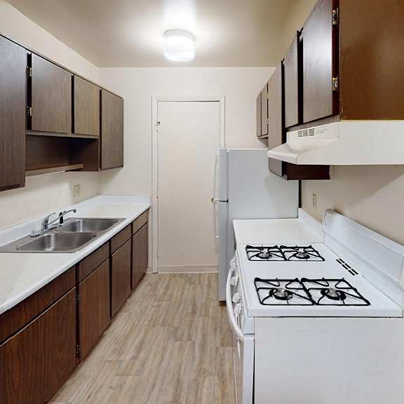 Thumbnail 7 of 14 A kitchen with a gas stove at Glen Oaks Apartments, Michigan, 49442