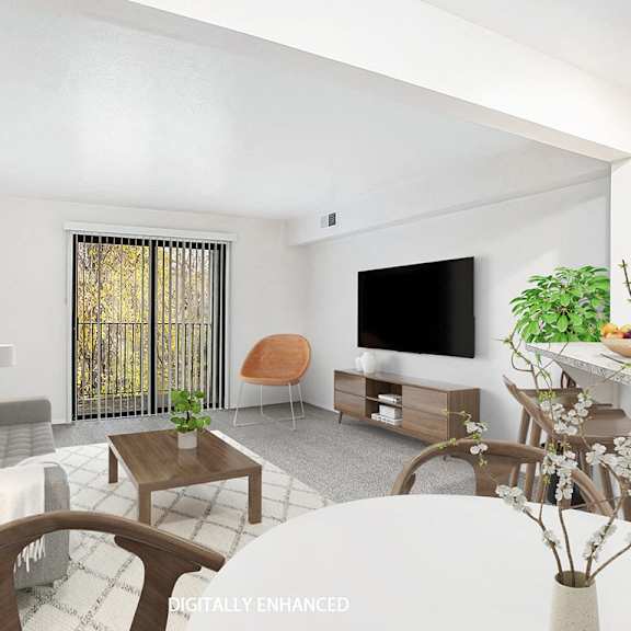 Thumbnail 3 of 16 An upgraded living room with a kitchen and a slider to a private balcony at Glenn Valley Apartments in Battle Creek, MI