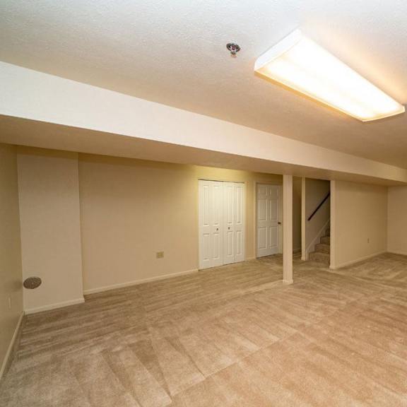 Thumbnail 23 of 28 finished basement with storage at Gull Prairie/Gull Run Apartments and Townhomes, Michigan