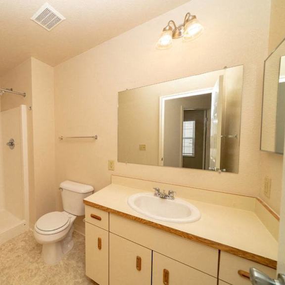 Thumbnail 13 of 14 a bathroom with a walk in shower at Gull Prairie/Gull Run Apartments and Townhomes, Michigan, 49048