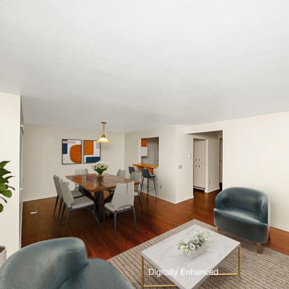 Thumbnail 4 of 14 a living room and dining room with a table and chairs at Gull Prairie/Gull Run Apartments and Townhomes, Michigan, 49048