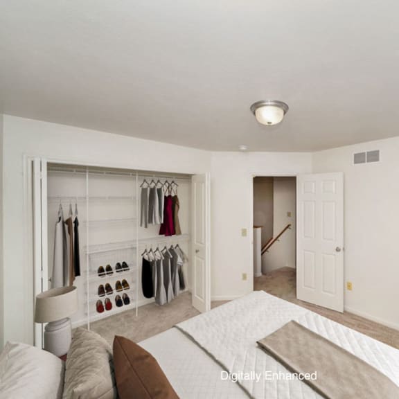 Thumbnail 10 of 14 a bedroom with a large closet with wardrobe organizers at Gull Prairie/Gull Run Apartments and Townhomes, Michigan, 49048
