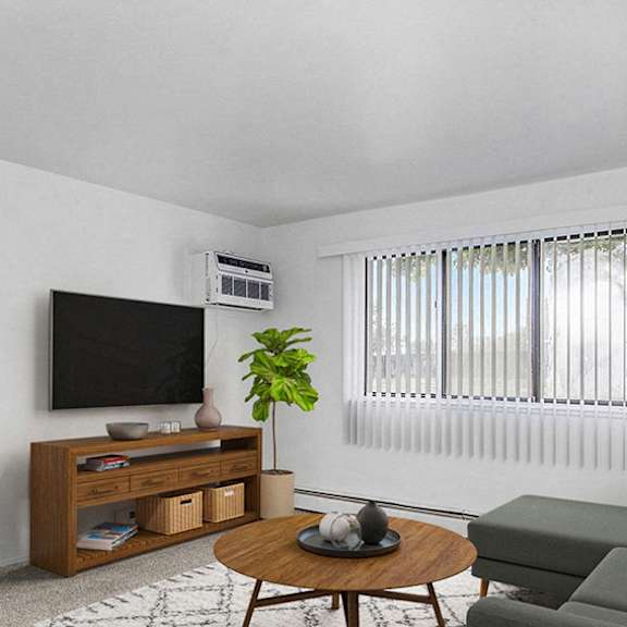 Thumbnail 4 of 9 A garden style living room leading to a balcony at Granada Apartments, Jackson, 49202