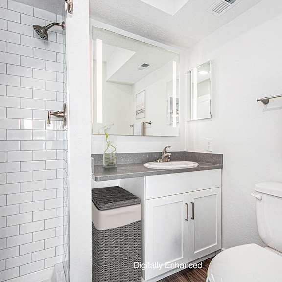 Thumbnail 14 of 14 A 2nd bathroom with a white tiled shower at Green Ridge Apartments, Grand Rapids, 49544