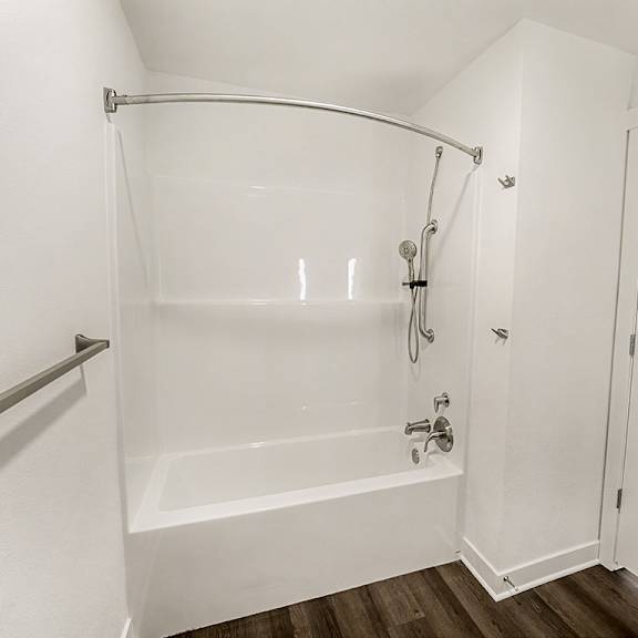 Thumbnail 15 of 19 A bathroom with a bathtub/shower combination at The Grove Apartment Homes, Lincoln