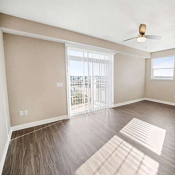 Thumbnail 3 of 13 An enlarged living room with an extra window and a 9' ceiling at The Grove Apartment Homes in Lincoln, NE