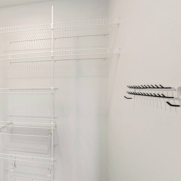 Thumbnail 11 of 14 Large walk-in closet with wardrobe organizers at The Grove Apartment Homes, Lincoln, NE