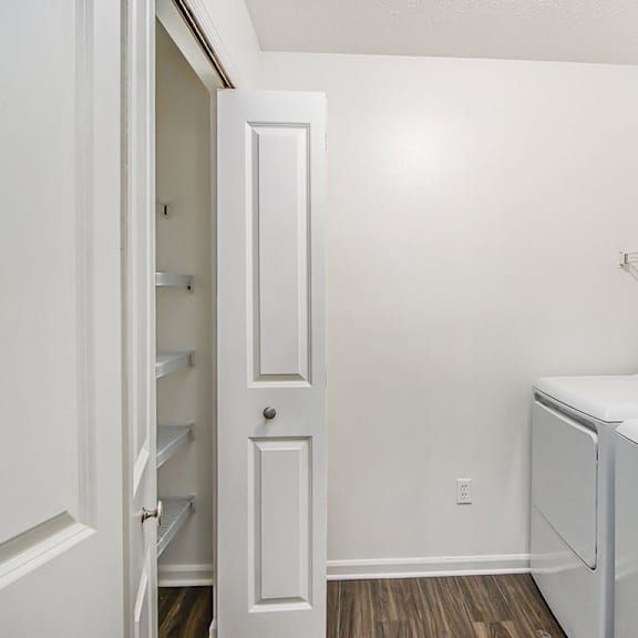 Thumbnail 6 of 9 A laundry room with a full-size washer and dryer at Gull Prairie/Gull Run Apartments and Townhomes, Michigan, 49048