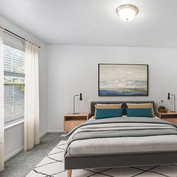 Thumbnail 11 of 18 A bedroom with a large bed with a closet with wardrobe organizers at Gull Prairie/Gull Run Apartments and Townhomes, Kalamazoo, Michigan