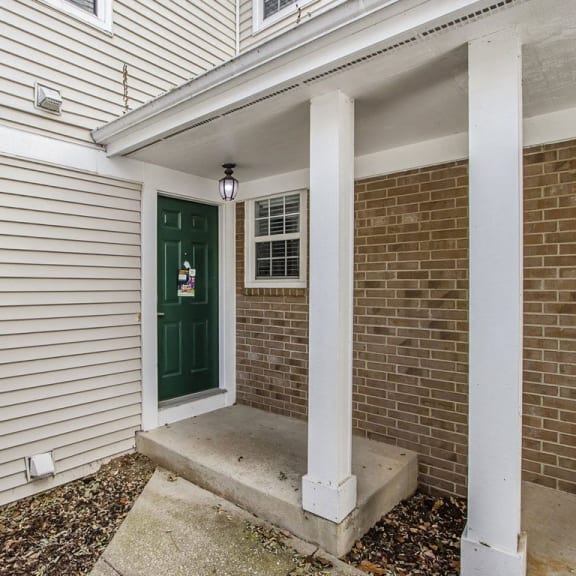 Thumbnail 3 of 28 a green townhome front door at Gull Prairie/Gull Run Apartments and Townhomes, Kalamazoo, MI