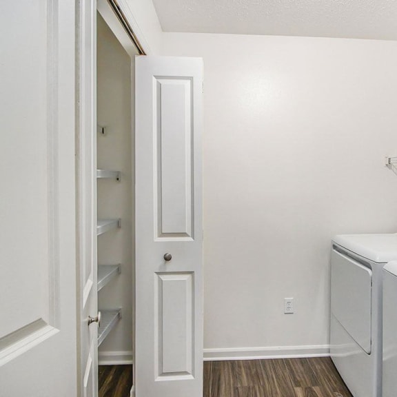 Thumbnail 11 of 28 laundry room with a washer and dryer and a closet at Gull Prairie/Gull Run Apartments and Townhomes, Kalamazoo, Michigan