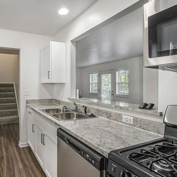 Thumbnail 7 of 15 kitchen with a gas stove and a dishwasher at Gull Prairie/Gull Run Apartments and Townhomes, Michigan, 49048