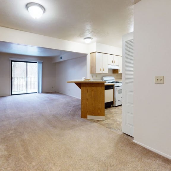 Thumbnail 4 of 16 an entry to a dining and living room at Glenn Valley Apartments, Battle Creek