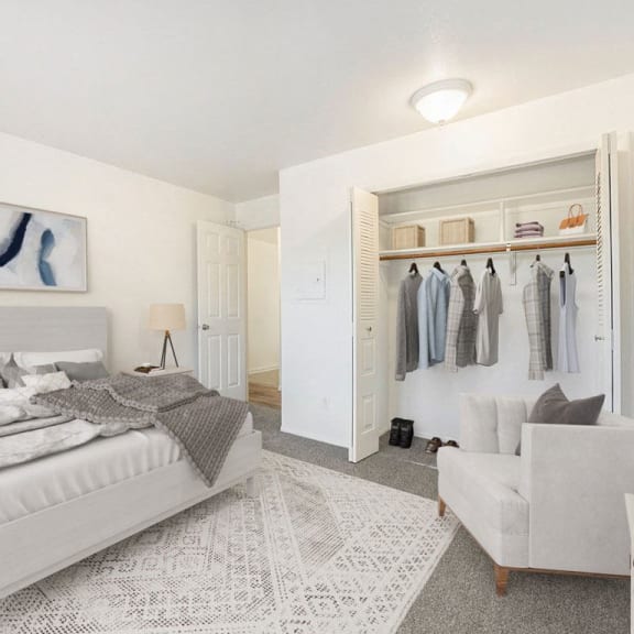 Thumbnail 12 of 14 a bedroom with a large closet at Hampton Lakes Apartments in Walker, MI 49534