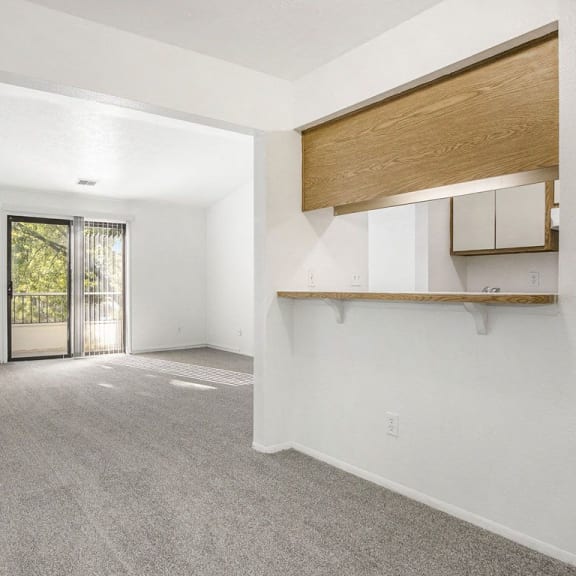Thumbnail 5 of 14 living room and dining room with carpet at Hampton Lakes Apartments, Michigan, 49534