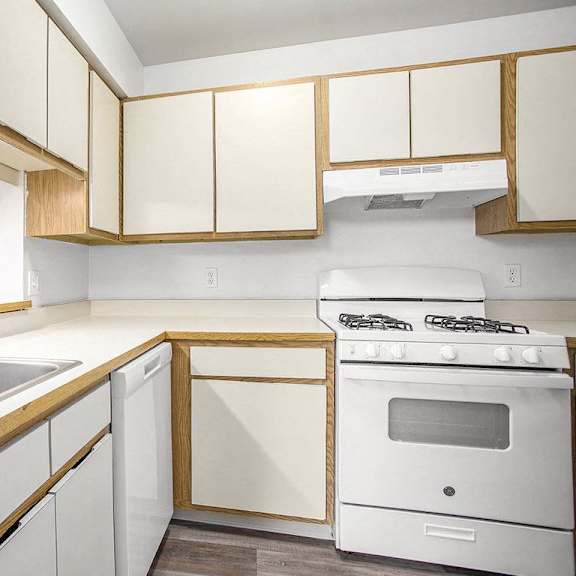Thumbnail 8 of 15 a kitchen with white appliances at Hampton Lakes Apartments, Michigan, 49534