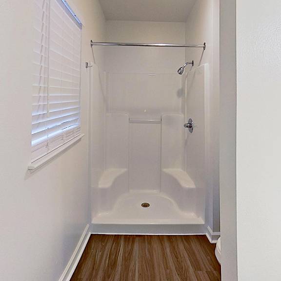 Thumbnail 17 of 18 A bathroom with a shower at Foxwood and The Hermitage, Michigan, 49024