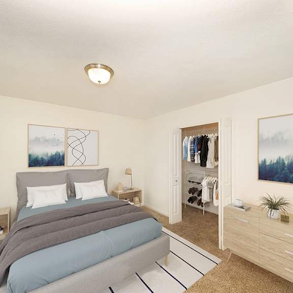 Thumbnail 9 of 15 a bedroom with a bed and a walk in closet at Foxwood and The Hermitage, Portage, MI, 49024