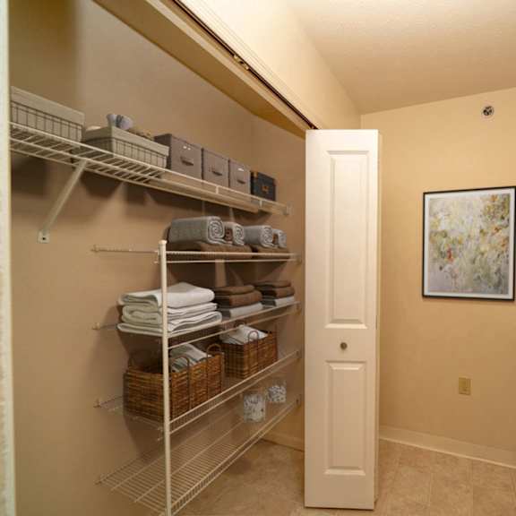 Thumbnail 7 of 15 a laundry room with a washer and dryer and a closet at Foxwood and The Hermitage, Portage, MI, 49024