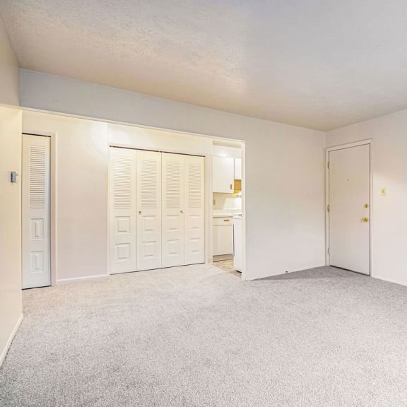 Thumbnail 4 of 11 an empty bedroom with a closet and a door to the bathroom at Hickory Village Apartments, Mishawaka, IN