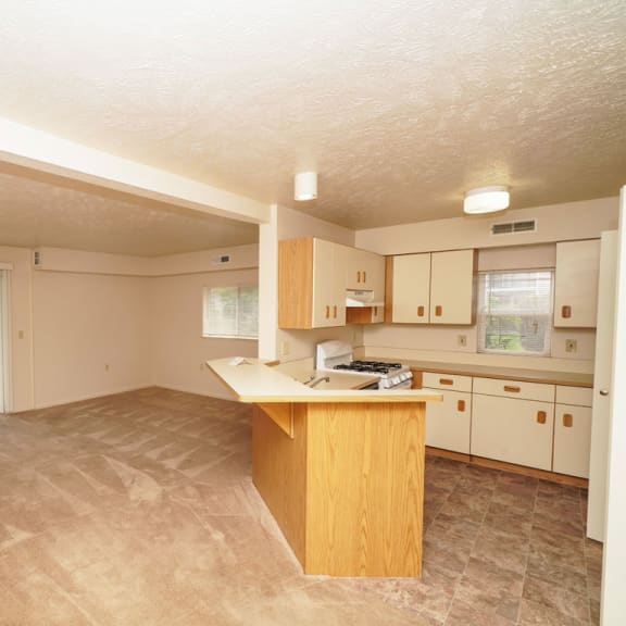 Thumbnail 3 of 6 Living room and kitchen at The Highlands Apartments, Elkhart, Indiana