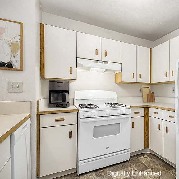 Thumbnail 6 of 13 a kitchen with white appliances and white cabinets at The Highlands Apartments, Elkhart