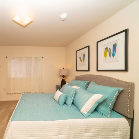 Thumbnail 7 of 7 a bedroom with a bed and a closet  at Hurwich Farms Apartments, South Bend, Indiana