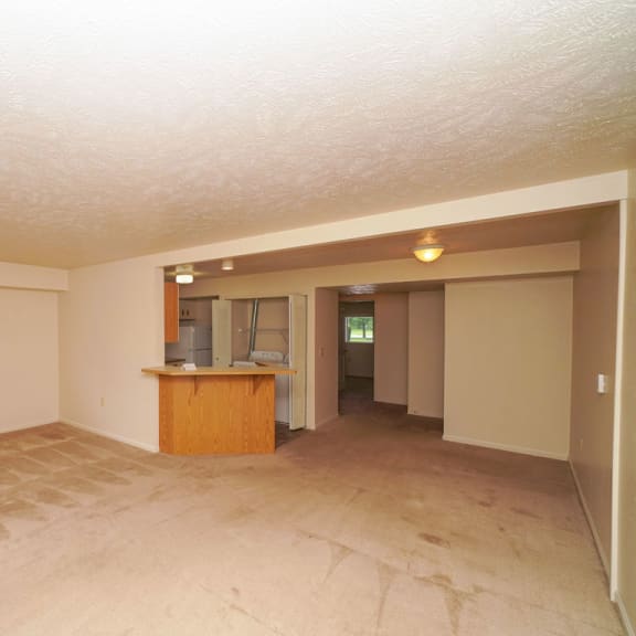Thumbnail 4 of 7 the living room and kitchen of an empty house  at Hurwich Farms Apartments, South Bend, 46628