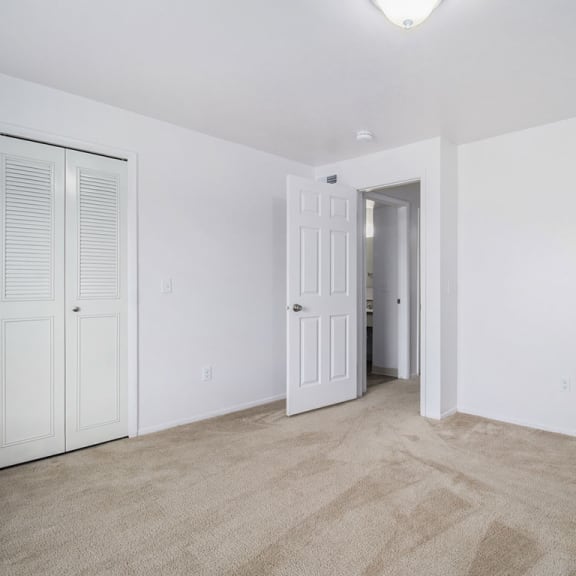 Thumbnail 14 of 17 Bedroom with large closets and a bathroom at Hurwich Farms Apartments, South Bend, IN