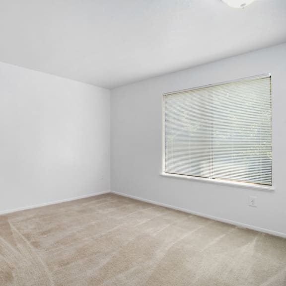 Thumbnail 15 of 17 Bedroom with white closets and carpeting  at Hurwich Farms Apartments, South Bend, IN