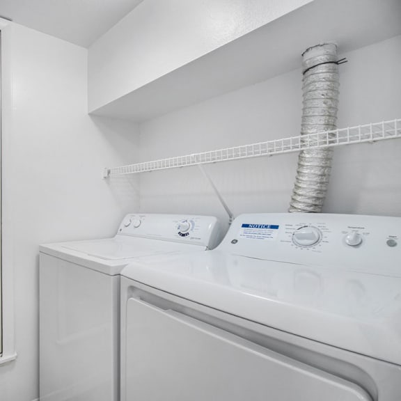 Thumbnail 10 of 17 a laundry room with a washer and dryer  at Hurwich Farms Apartments, South Bend, IN
