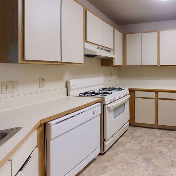 Thumbnail 6 of 9 Kitchen with white appliances at Indian Lakes Apartments, Indiana