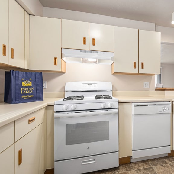 Thumbnail 7 of 12 a kitchen with white appliances at Indian Lakes Apartments, Indiana