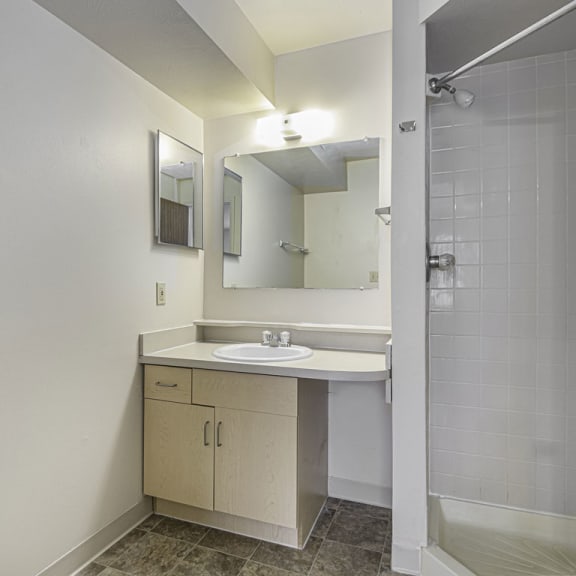 Thumbnail 13 of 13 a bathroom with a sink and a mirror at Indian Lakes Apartments, Mishawaka, IN