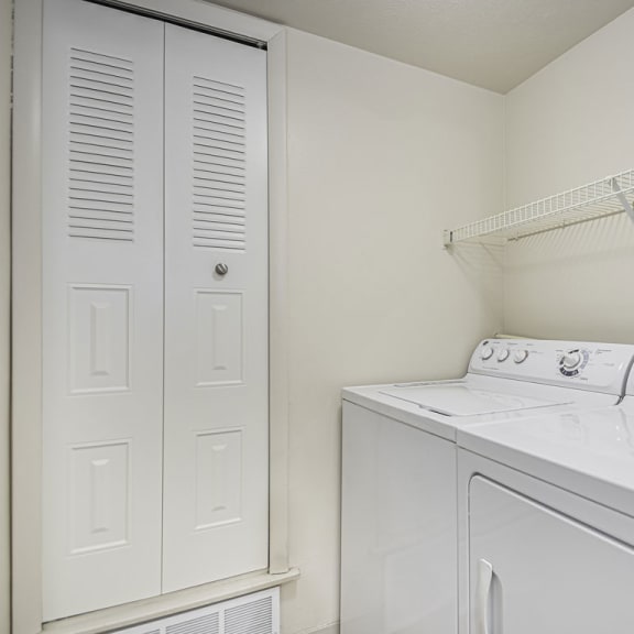 Thumbnail 8 of 13 a white laundry room at Indian Lakes Apartments, Mishawaka, Indiana