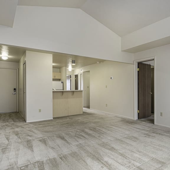 Thumbnail 5 of 13 the living room with cathedral ceiling at Indian Lakes Apartments, Mishawaka